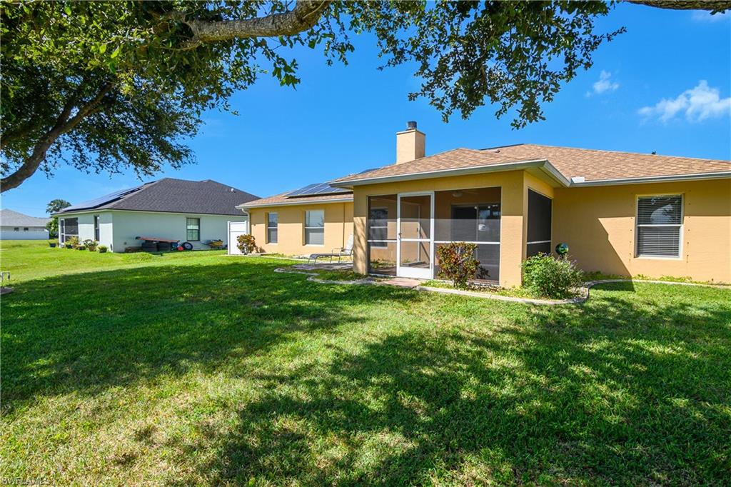 2905 Northeast 1st Place Cape Coral, FL 33909 - Photo 27 of 32 a view of an house with backyard space and garden