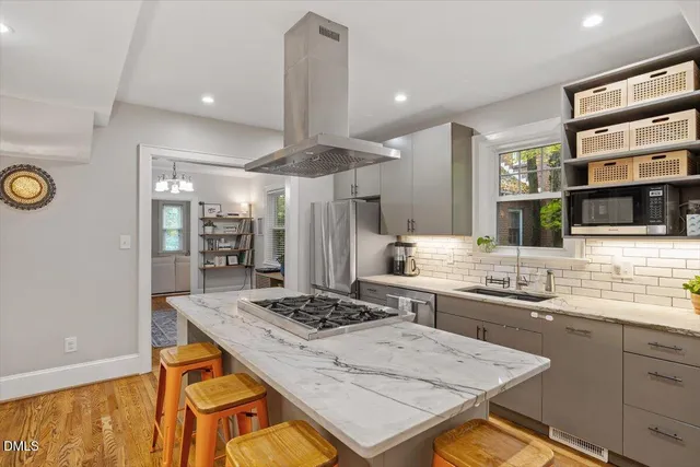 a kitchen with a table and chairs in it