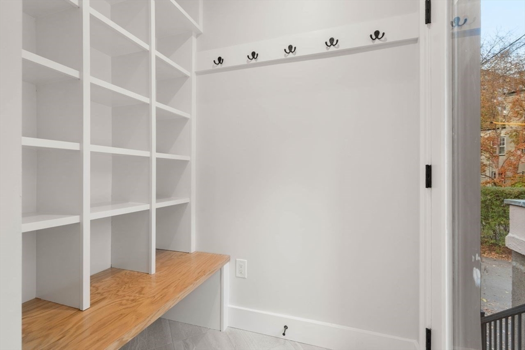 63 Griggs Road Brookline, MA 02446 - Photo 18 of 20 a view of walk in closet with empty racks