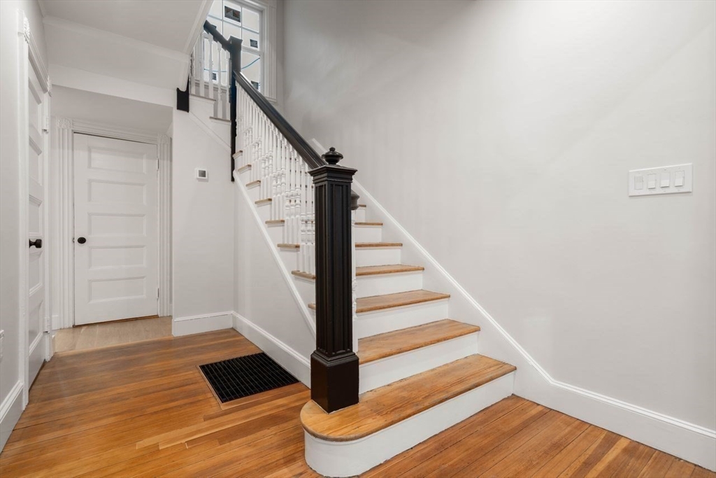 63 Griggs Road Brookline, MA 02446 - Photo 9 of 20 a view of entryway with wooden floor