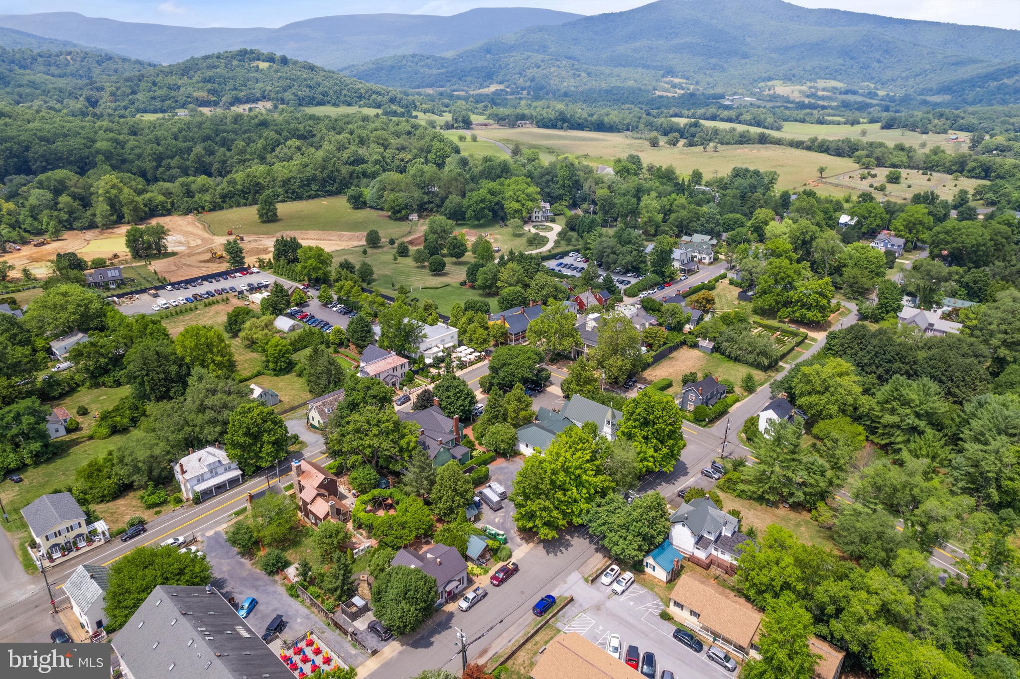 Aileen Road Flint Hill, VA 22627 - Photo 12 of 23 an aerial view of a city with lots of residential buildings and mountain view in back