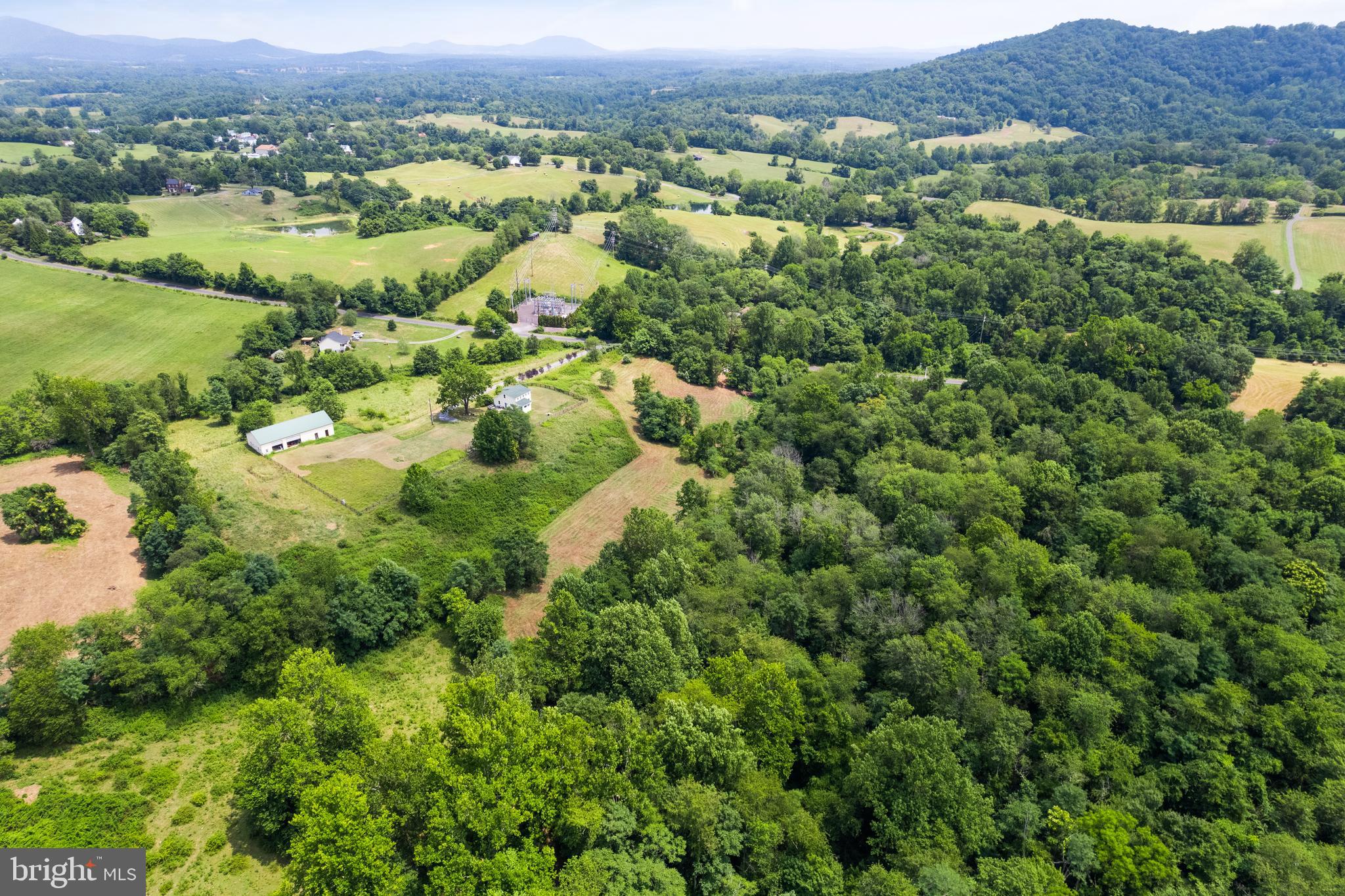 Aileen Road Flint Hill, VA 22627 - Photo 15 of 23 an aerial view of a houses with a lush green hillside