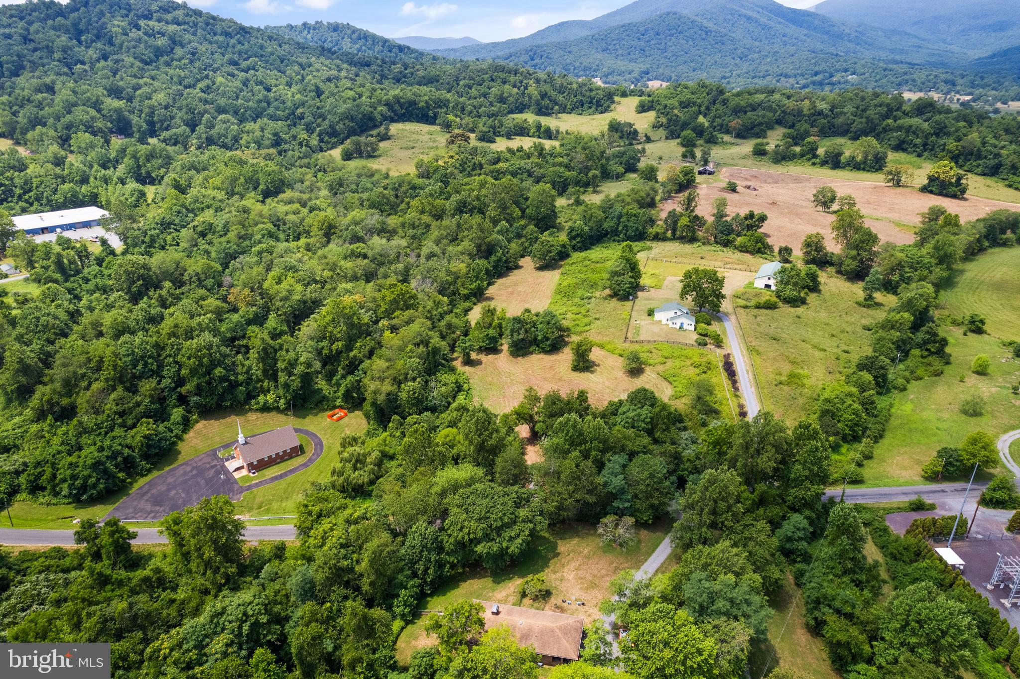 Aileen Road Flint Hill, VA 22627 - Photo 16 of 23 an aerial view of a house with a yard and lake view