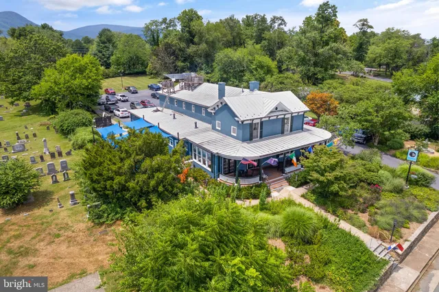 an aerial view of a house with a garden
