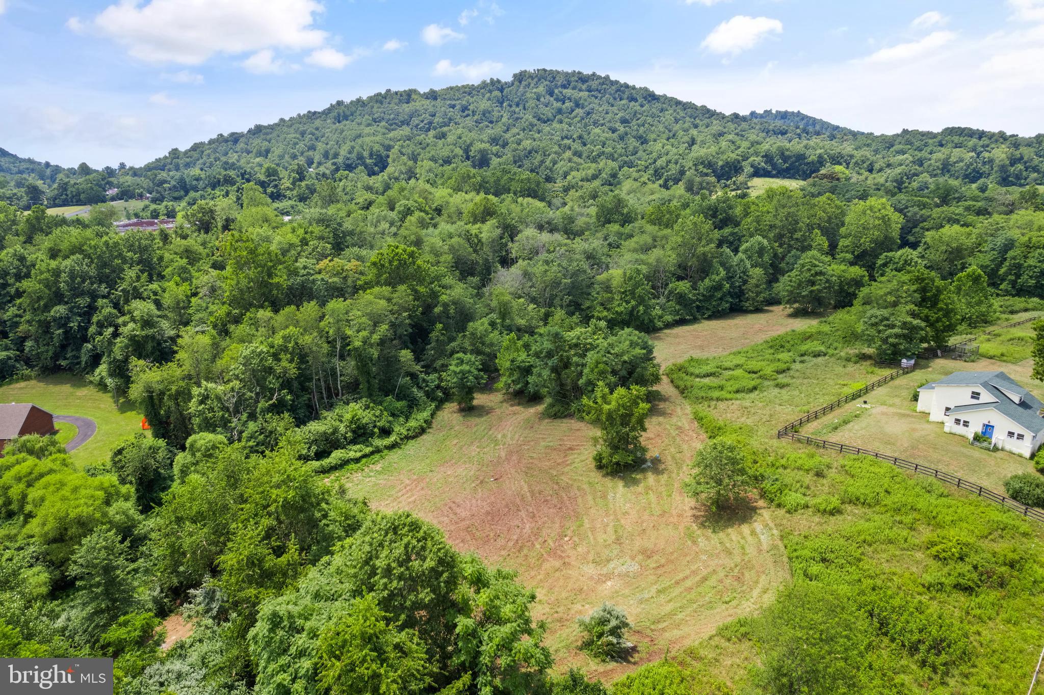 Aileen Road Flint Hill, VA 22627 - Photo 2 of 23 a view of a garden with a building in the background
