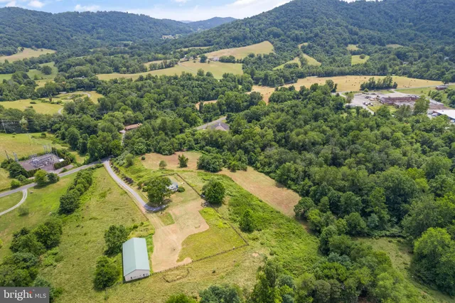 an aerial view of houses with yard