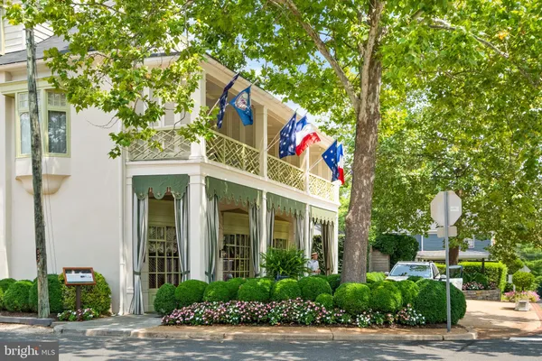 a front view of a building with garden