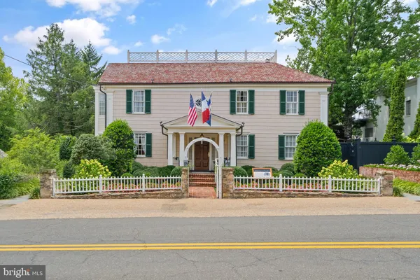 a view of a house next to a yard