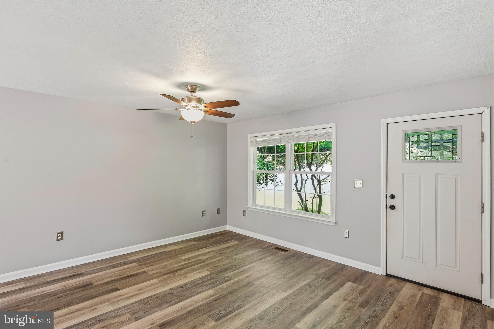 997 Wilderness Road Linden, VA 22642 - Photo 15 of 61 Living room with ceiling fan