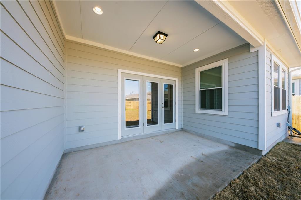 204 Cold Spg Loop Bastrop, TX 78602 - Photo 4 of 34 Covered concrete patio with French doors and recessed lighting