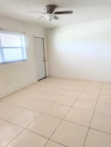 an empty room with fan