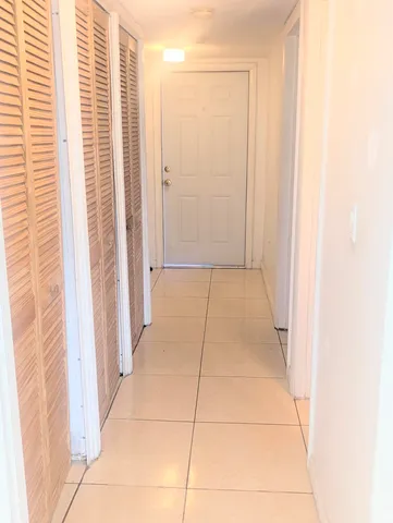 a view of a livingroom with an empty space and a window