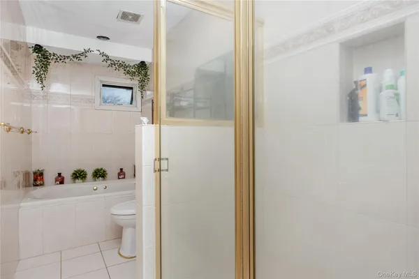a bathroom with a granite countertop shower curtain