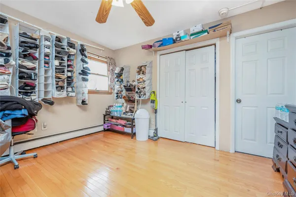 a bedroom with a bed and a book shelf