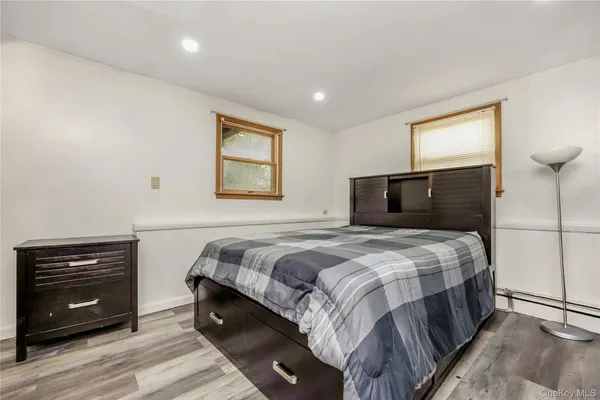 a bedroom with a bed and a tv