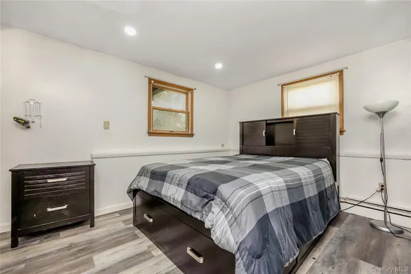 a bedroom with a bed and a tv