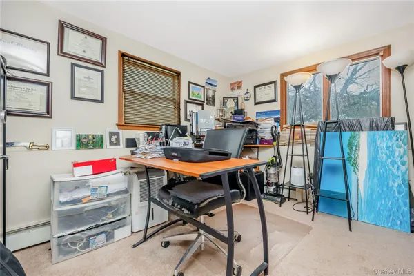 a workspace with furniture and a window