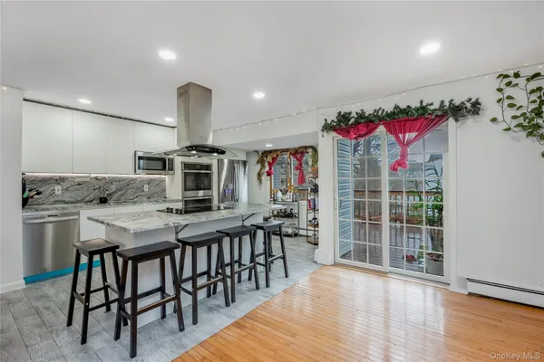 a view of a kitchen and dining room