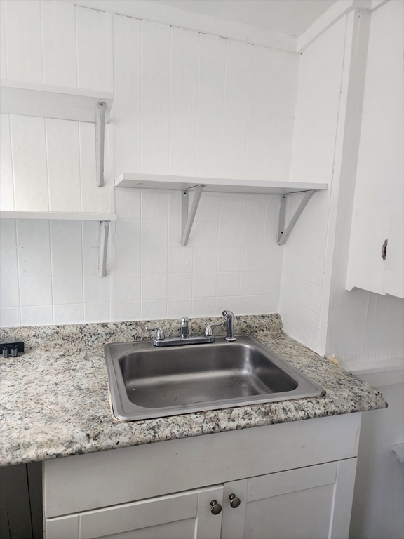 141 Franklin Street, Unit 2 Lynn, MA 01902 - Photo 4 of 6 a close view of sink and tap