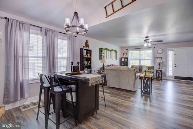 a view of a dining room with furniture window and wooden floor