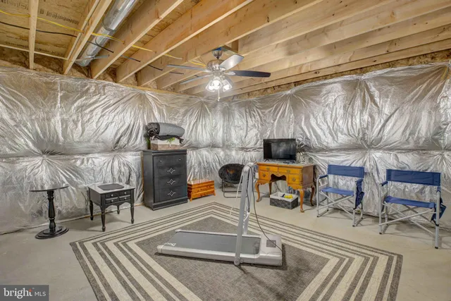 a view of a livingroom with furniture and a rug