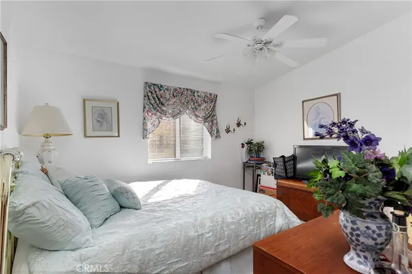 a bed room with furniture and a chandelier