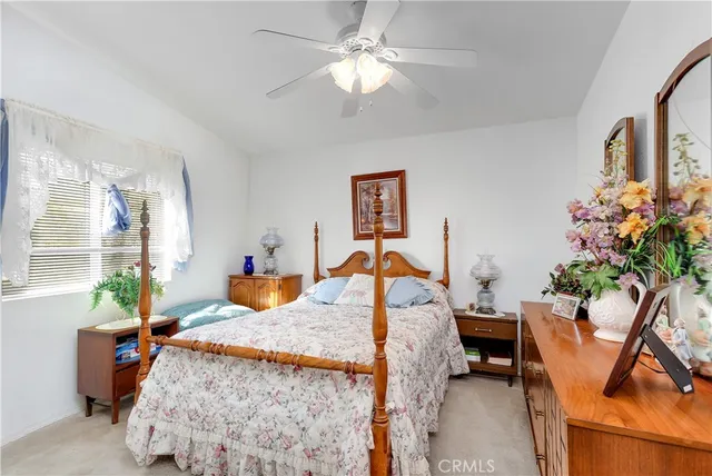 a bed room with furniture and a chandelier