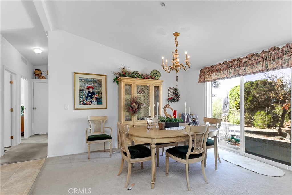 29520 Piani Road Pearblossom, CA 93553 - Photo 23 of 34 a view of a dining room with furniture and a chandelier