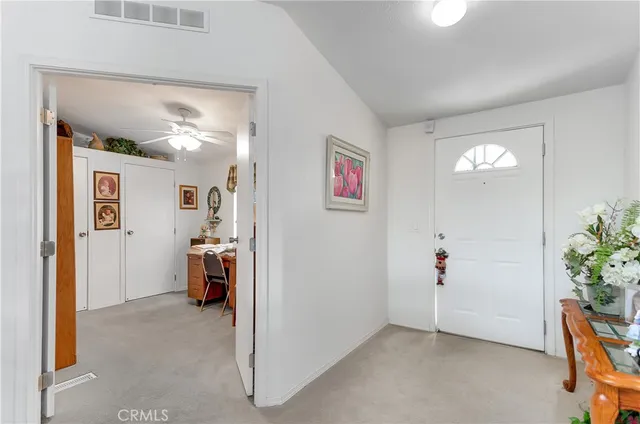 a view of livingroom with hardwood floor and a ceiling fan