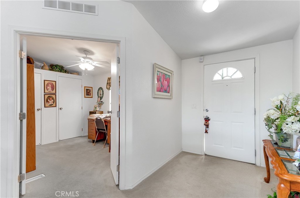 29520 Piani Road Pearblossom, CA 93553 - Photo 24 of 34 a view of livingroom with hardwood floor and a ceiling fan