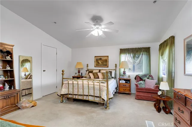 a bedroom with bed and window