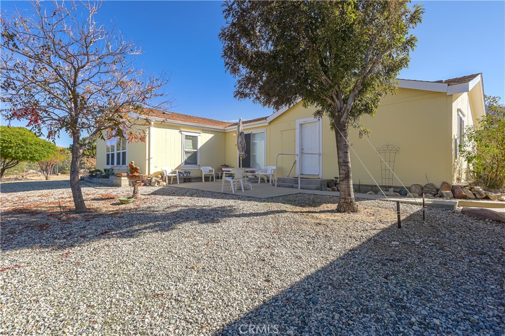 29520 Piani Road Pearblossom, CA 93553 - Photo 32 of 34 a tree in front of a house