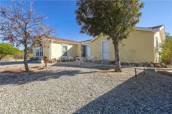 a tree in front of a house