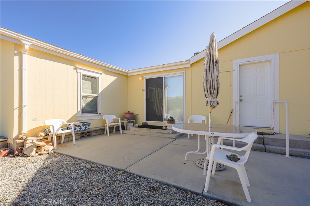 29520 Piani Road Pearblossom, CA 93553 - Photo 5 of 34 a living room with furniture and a large window