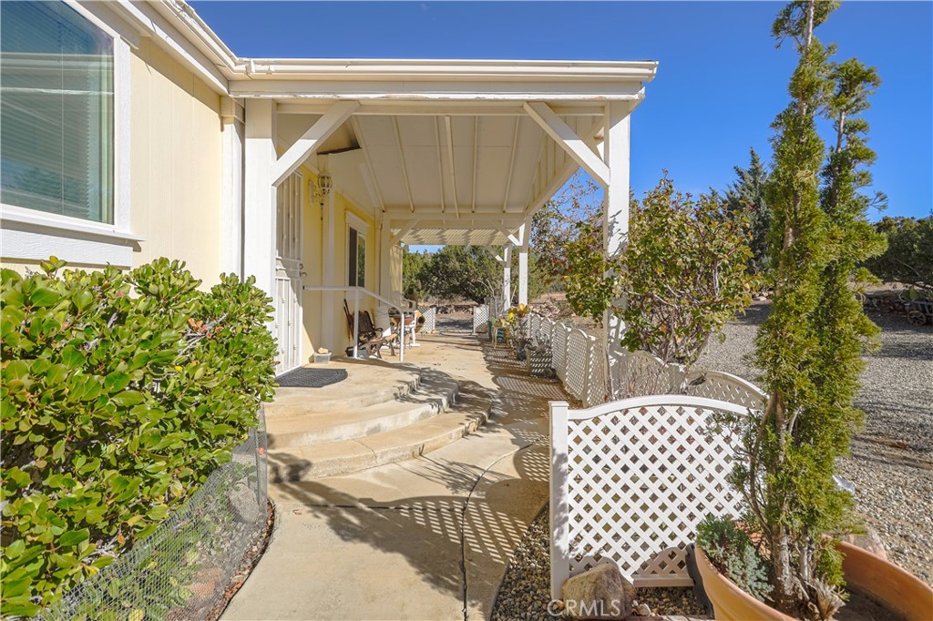 29520 Piani Road Pearblossom, CA 93553 - Photo 8 of 34 a view of two chairs and table in the patio