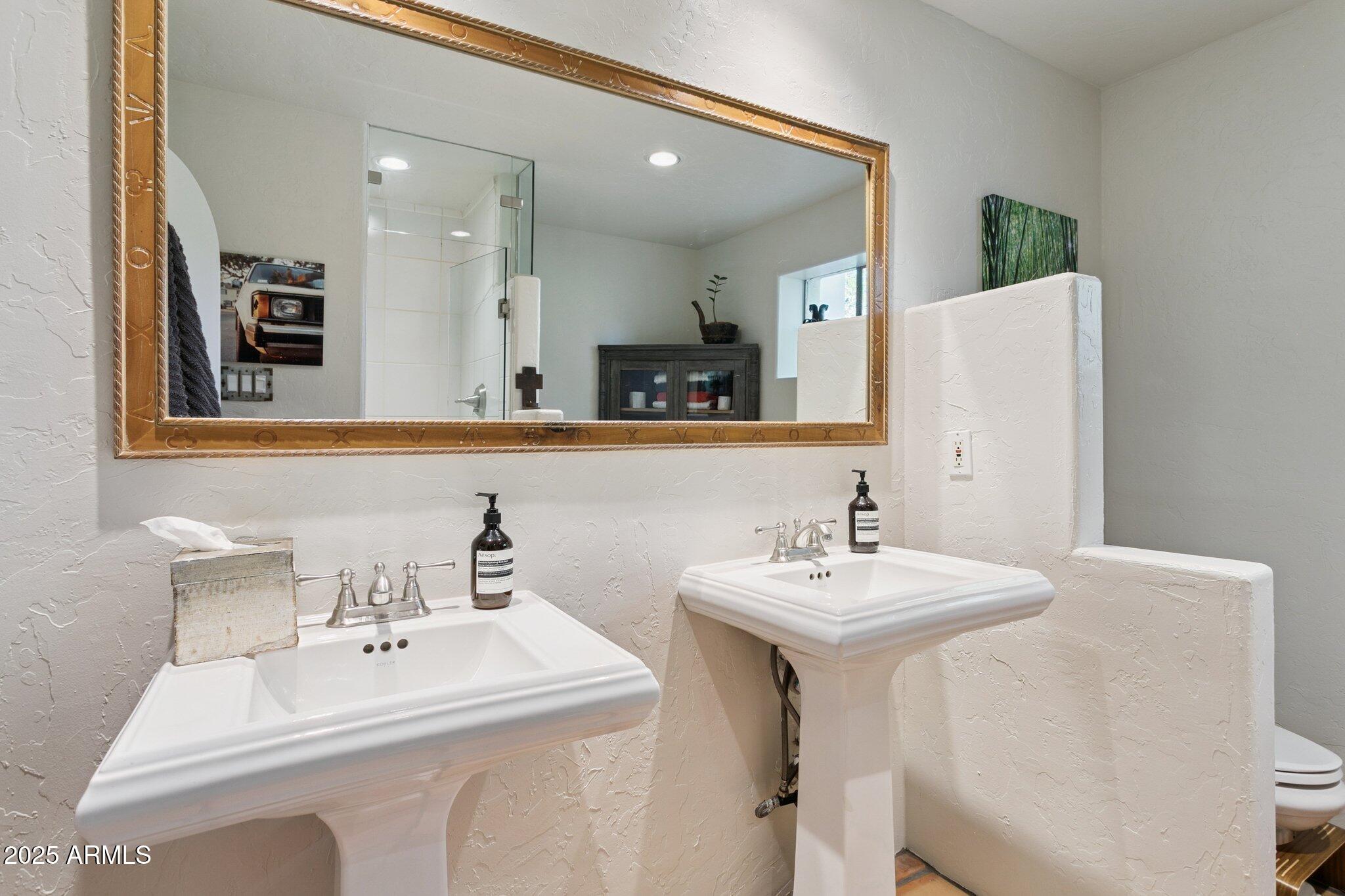 7005 East Jackrabbit Road Paradise Valley, AZ 85253 - Photo 33 of 61 a bathroom with a sink and a mirror