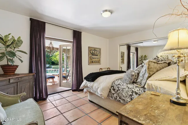 a living room filled with furniture and a potted plant