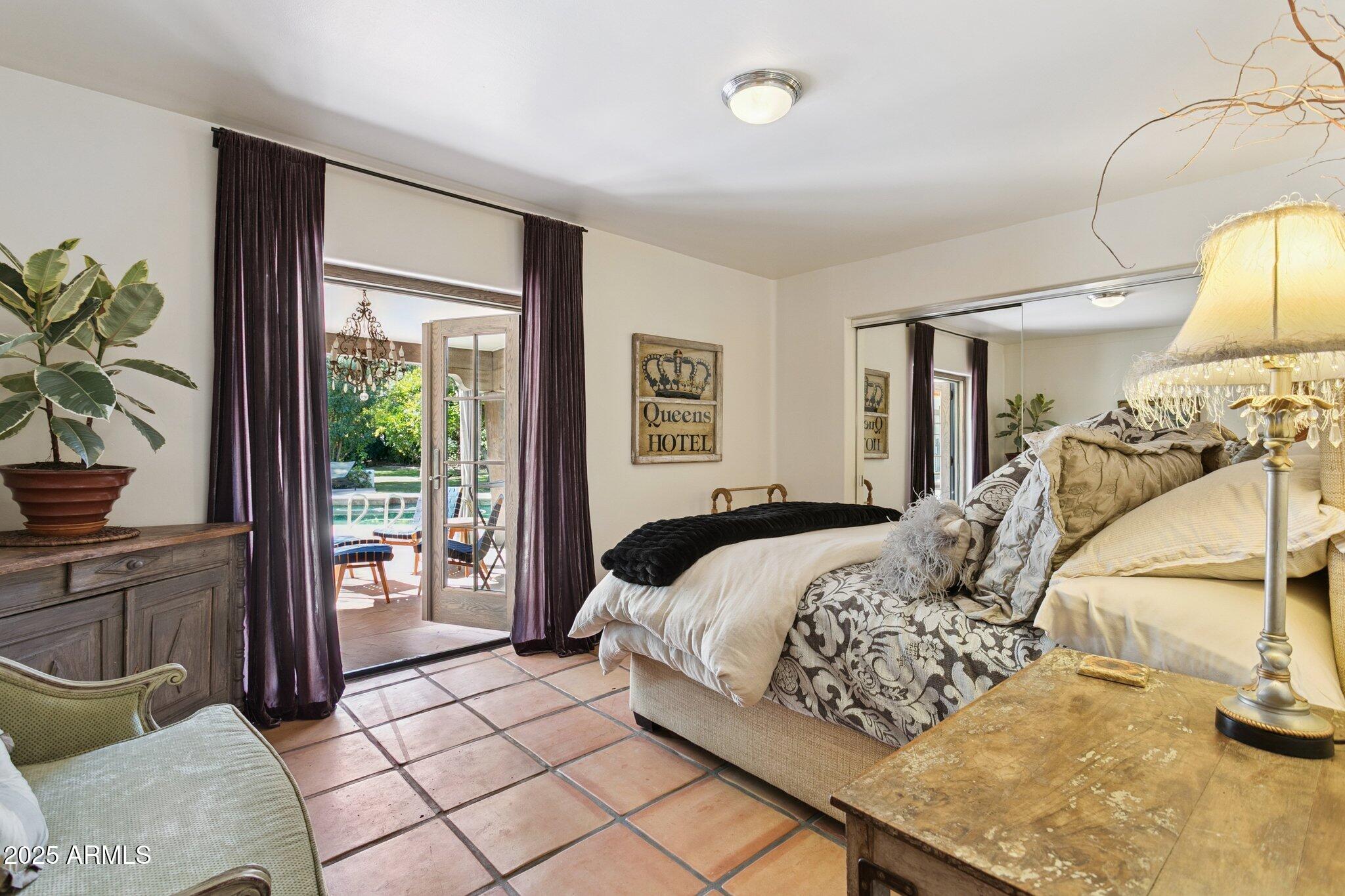 7005 East Jackrabbit Road Paradise Valley, AZ 85253 - Photo 36 of 61 a bedroom with a bed and a window