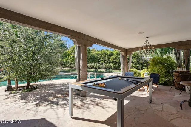 a view of a swimming pool with a patio