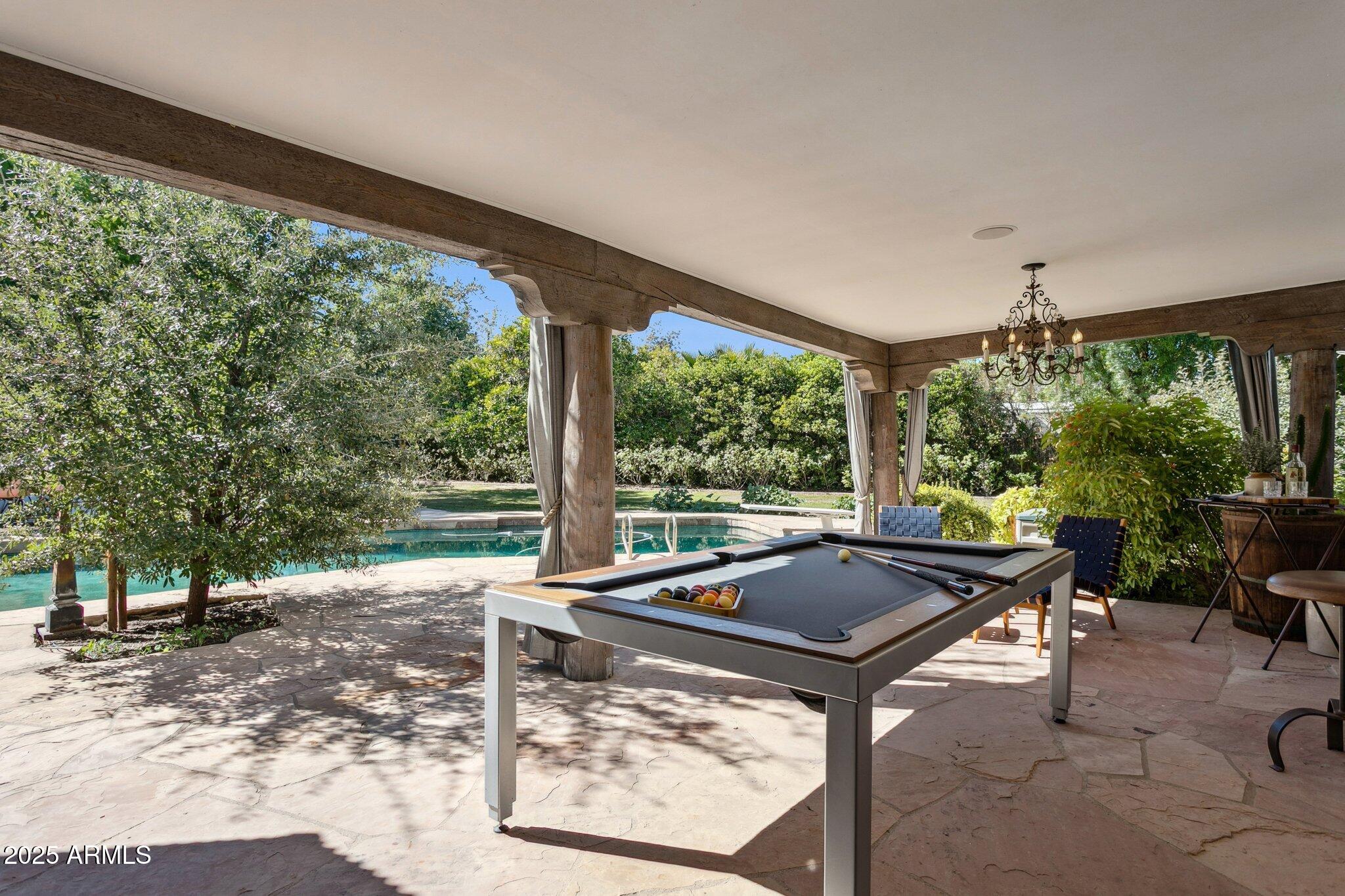 7005 East Jackrabbit Road Paradise Valley, AZ 85253 - Photo 39 of 61 a view of swimming pool with chairs in patio