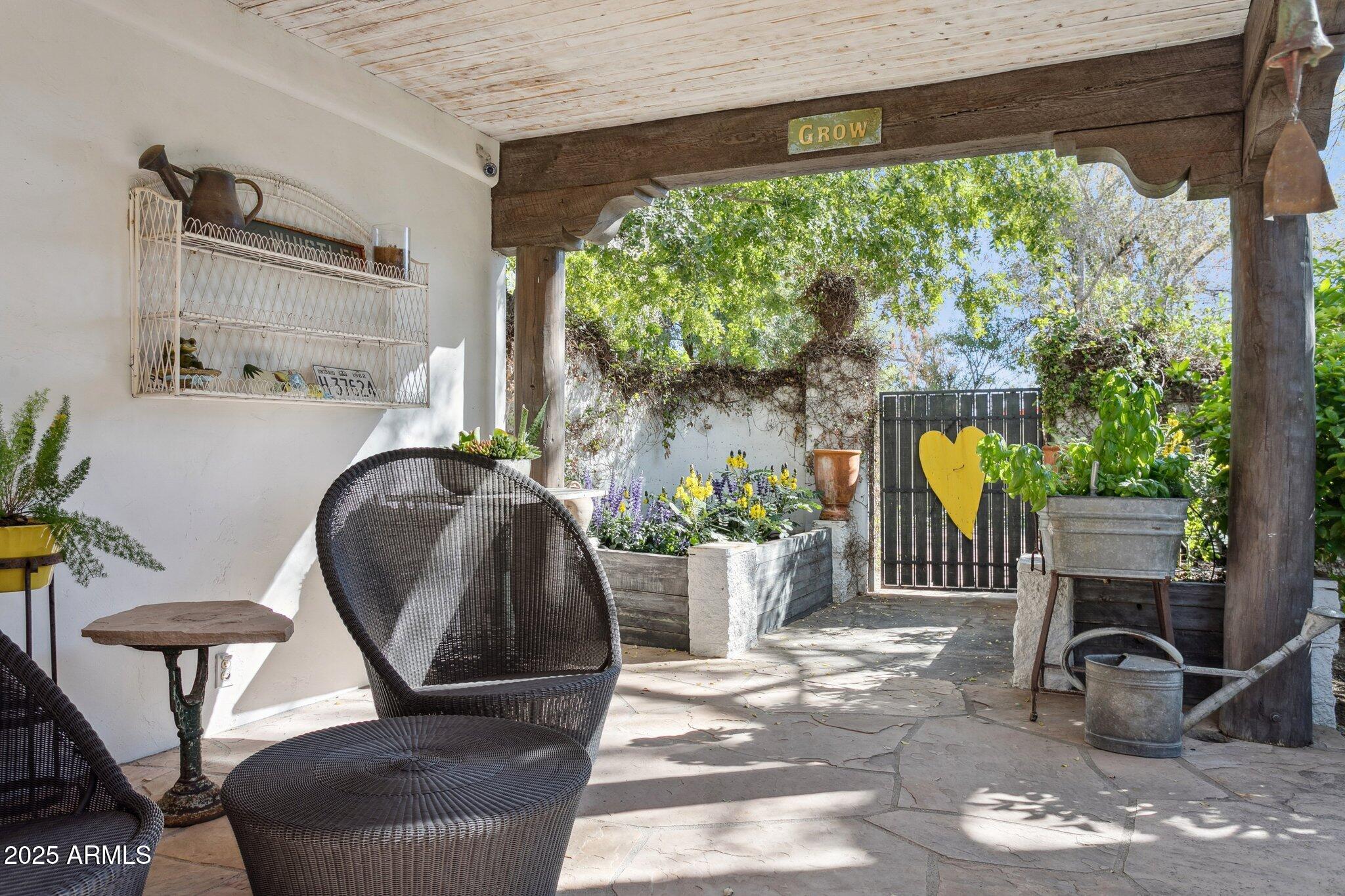 7005 East Jackrabbit Road Paradise Valley, AZ 85253 - Photo 43 of 61 a living room filled with furniture and a potted plant