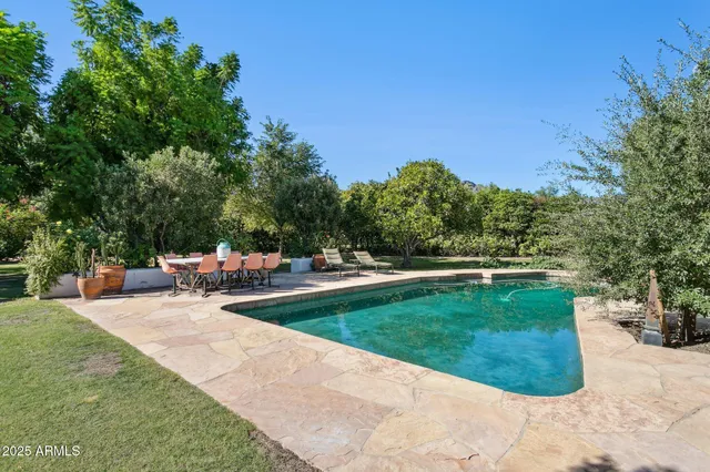 a front view of a house with a street