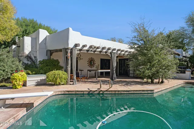 a kitchen with stainless steel appliances granite countertop a stove and a microwave