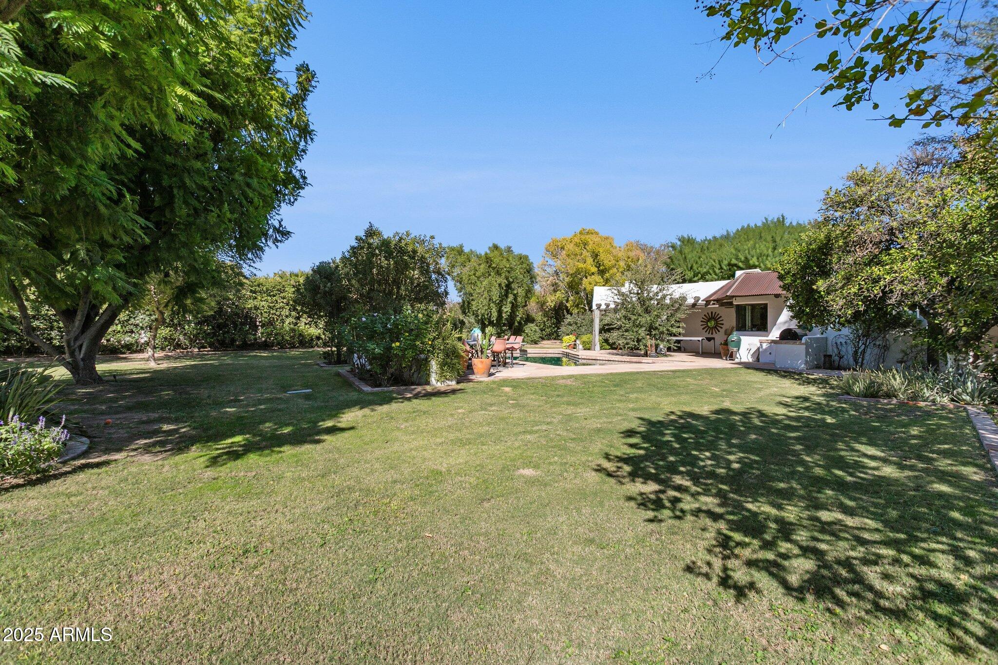 7005 East Jackrabbit Road Paradise Valley, AZ 85253 - Photo 51 of 61 a view of a field with large trees