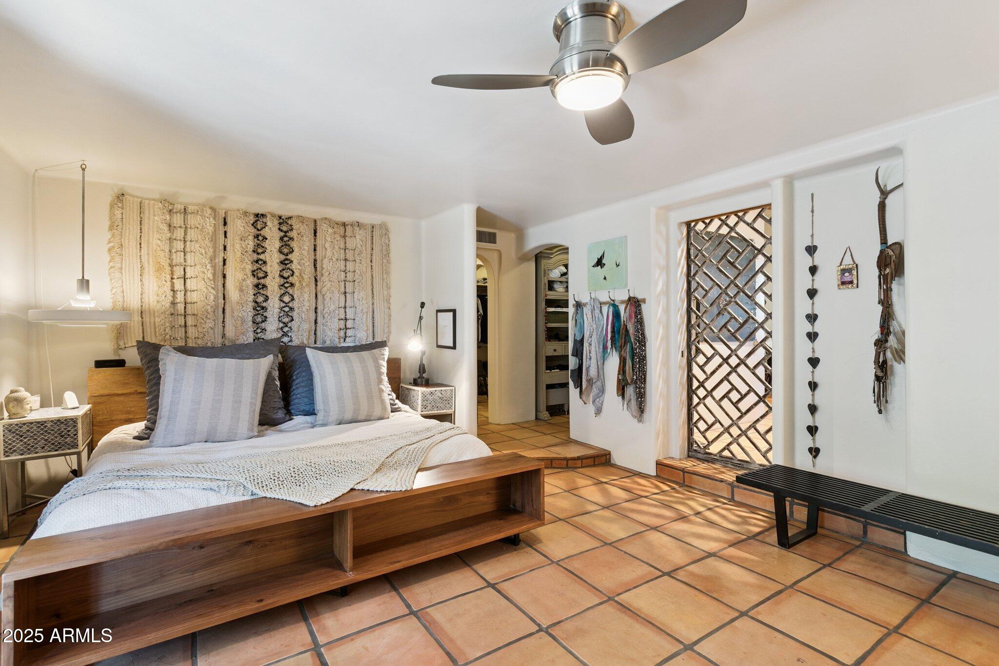 7005 East Jackrabbit Road Paradise Valley, AZ 85253 - Photo 56 of 61 a bedroom with a large bed and a window