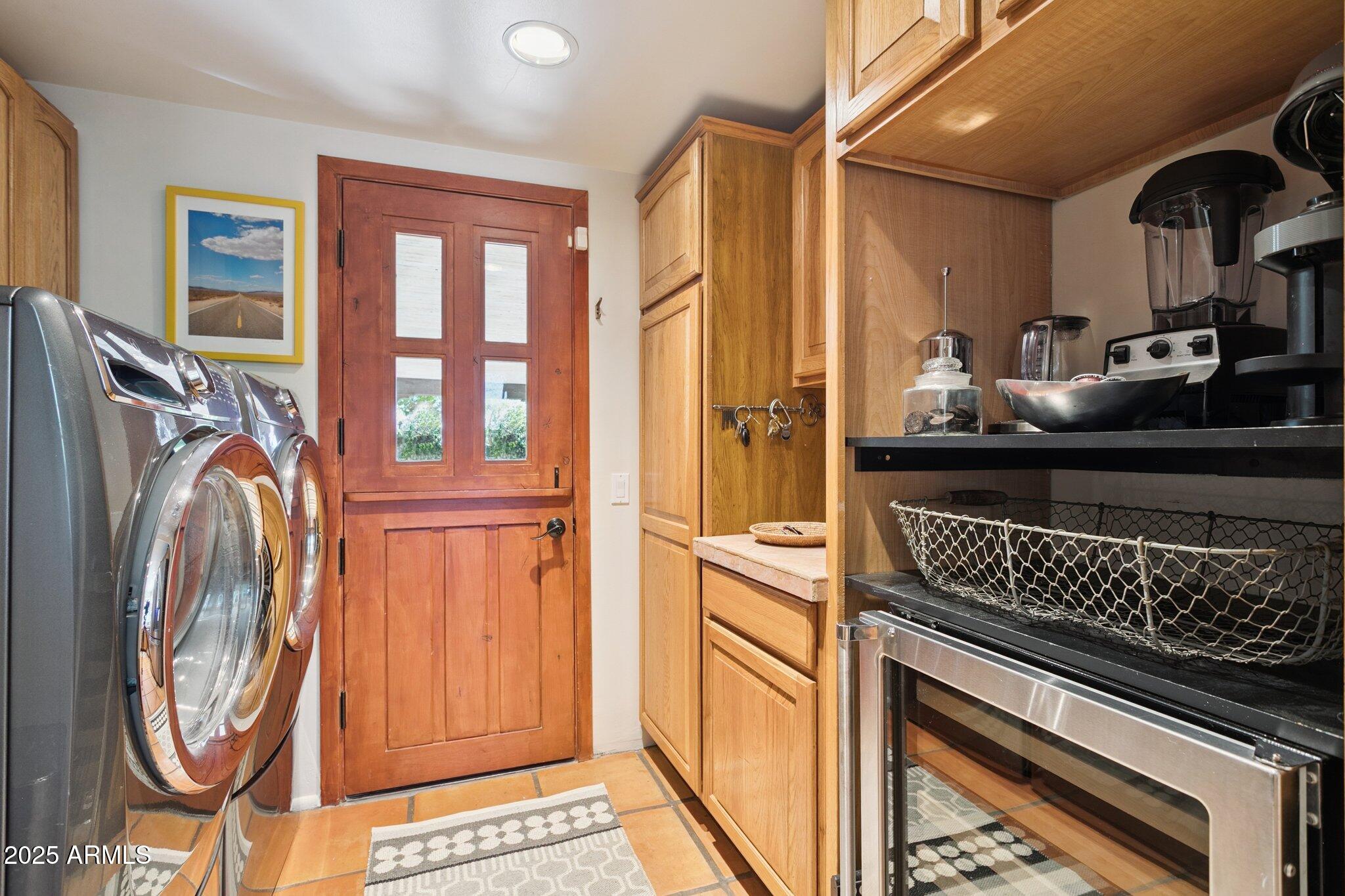 7005 East Jackrabbit Road Paradise Valley, AZ 85253 - Photo 57 of 61 a kitchen with stainless steel appliances granite countertop a stove and a microwave
