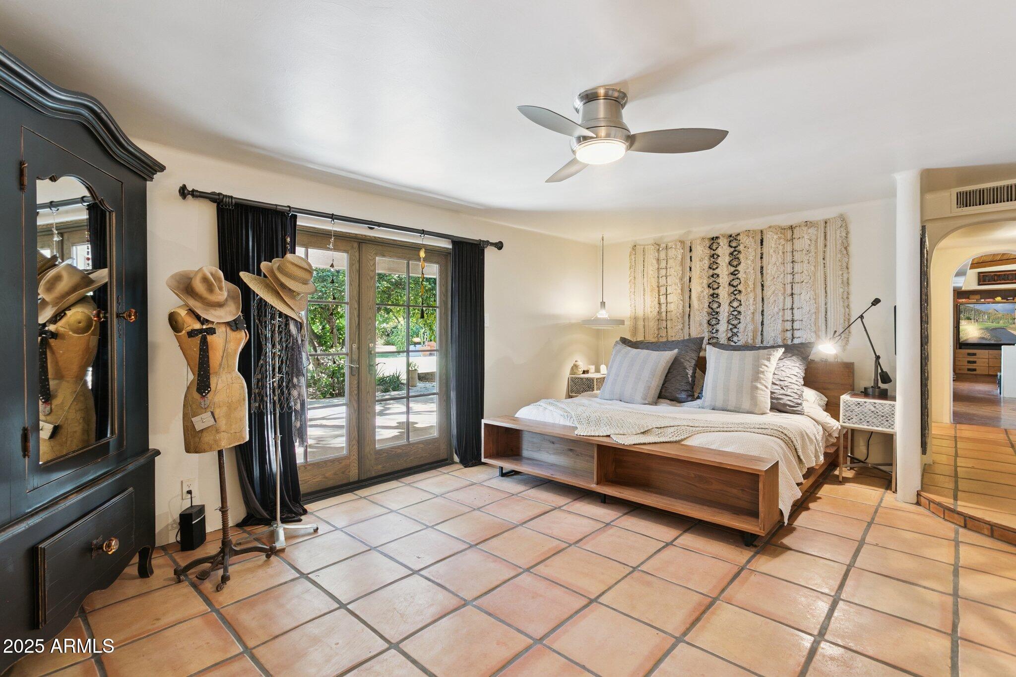 7005 East Jackrabbit Road Paradise Valley, AZ 85253 - Photo 58 of 61 a bedroom with a large bed and a window