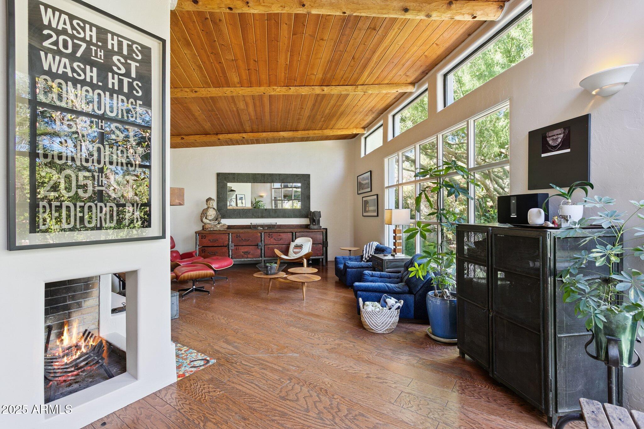7005 East Jackrabbit Road Paradise Valley, AZ 85253 - Photo 6 of 61 a living room with furniture a window and potted plants