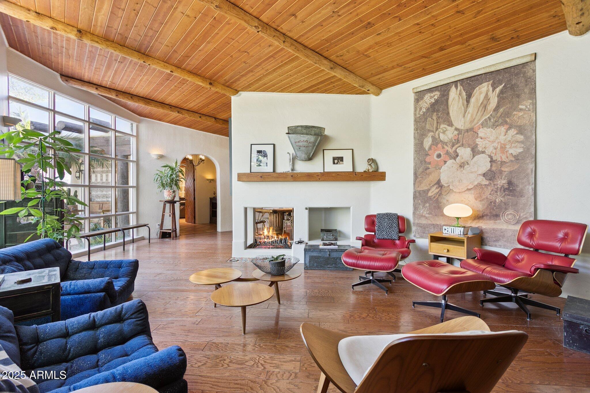 7005 East Jackrabbit Road Paradise Valley, AZ 85253 - Photo 7 of 61 a living room with furniture and a fireplace