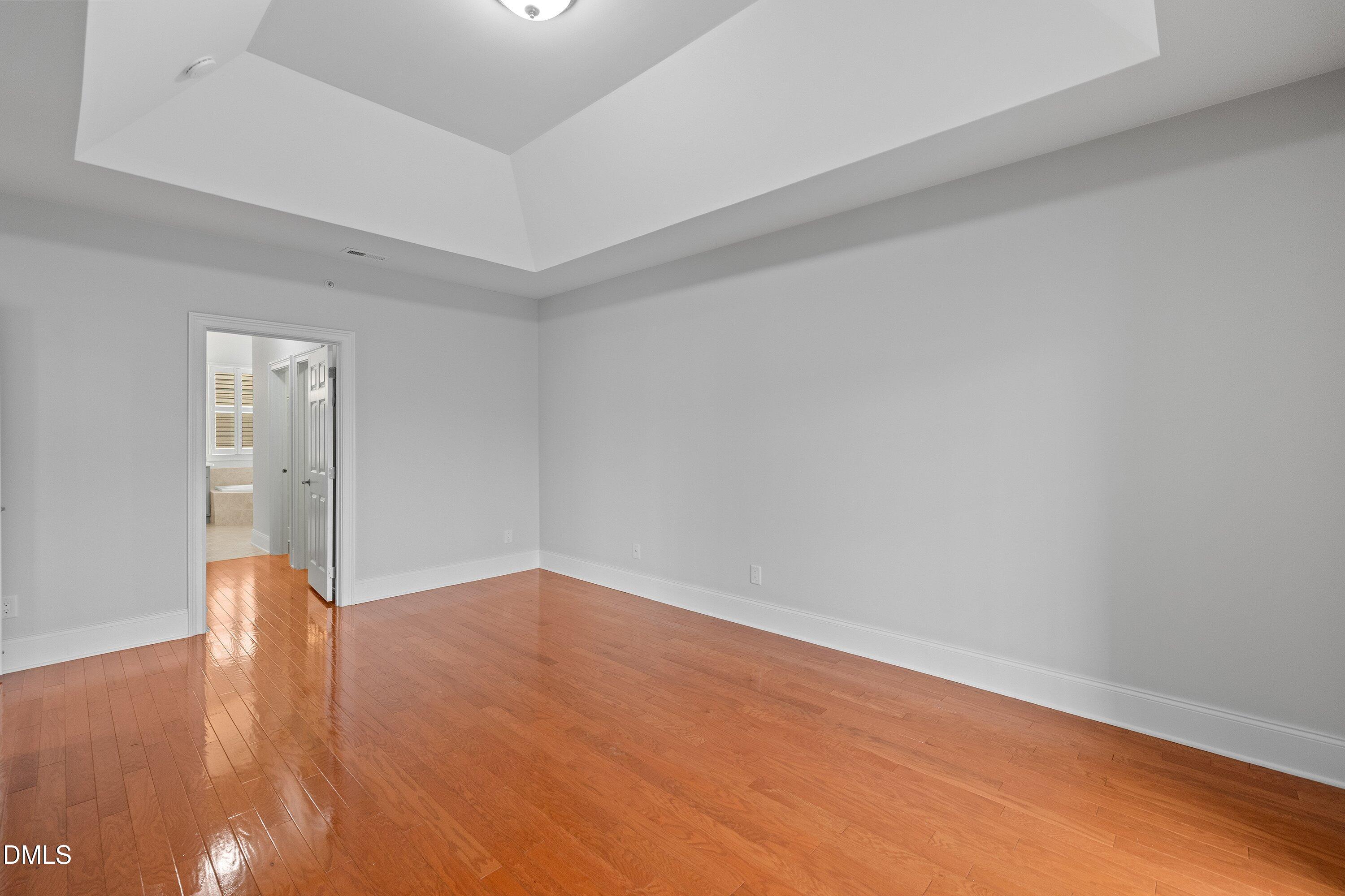 9211 Calabria Drive, Unit 205 Raleigh, NC 27617 - Photo 39 of 55 a view of empty room with wooden floor